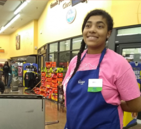 a girl working at a grocery store